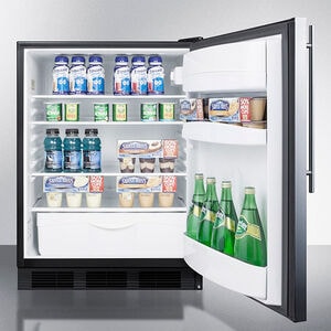 Interior view of Summit built-in refrigerator with adjustable glass shelves, crisper drawer, and door storage