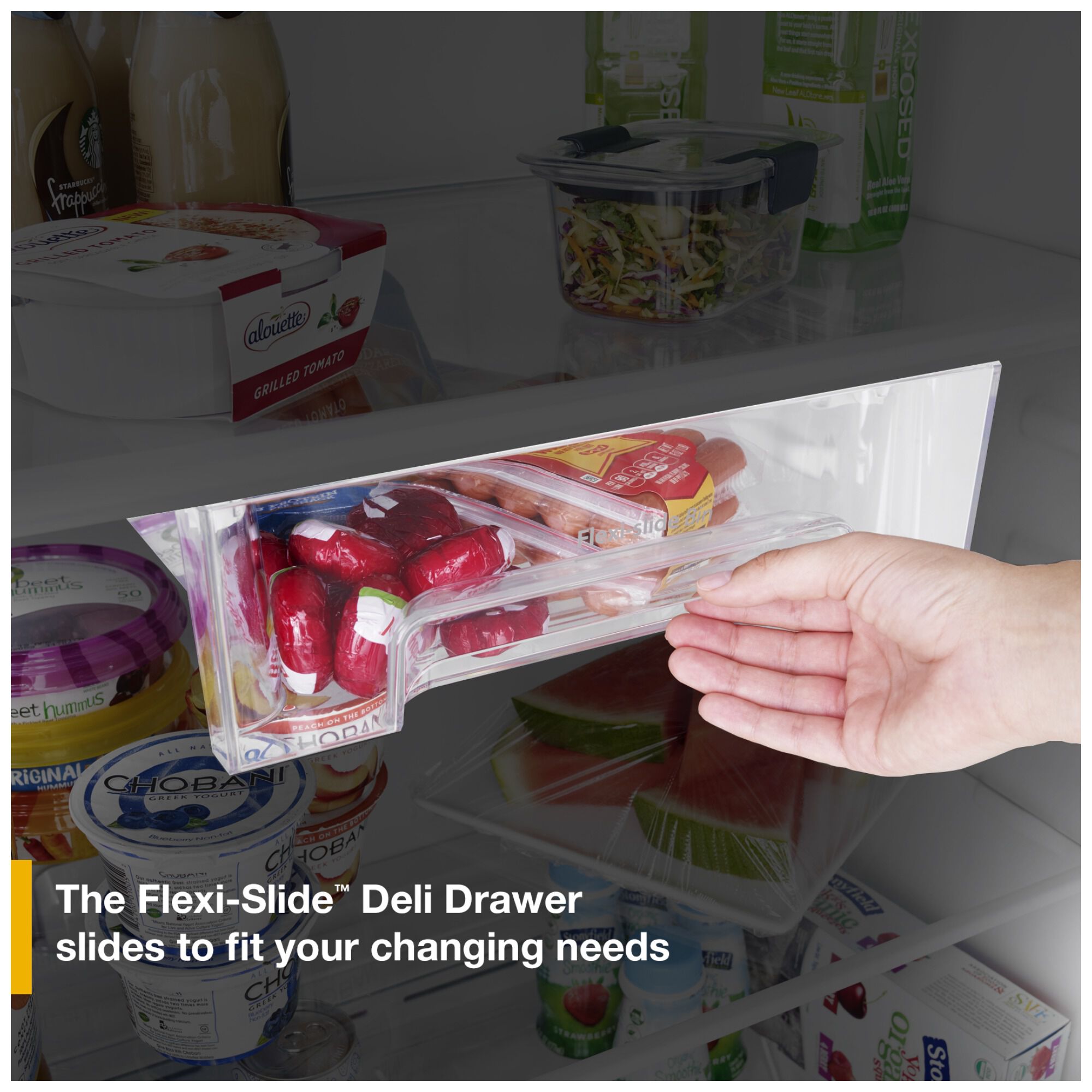 Hand sliding the Whirlpool WRTX5118TB refrigerator Flexi-Slide deli drawer across a shelf, showing it adjusts position to fit changing storage needs.