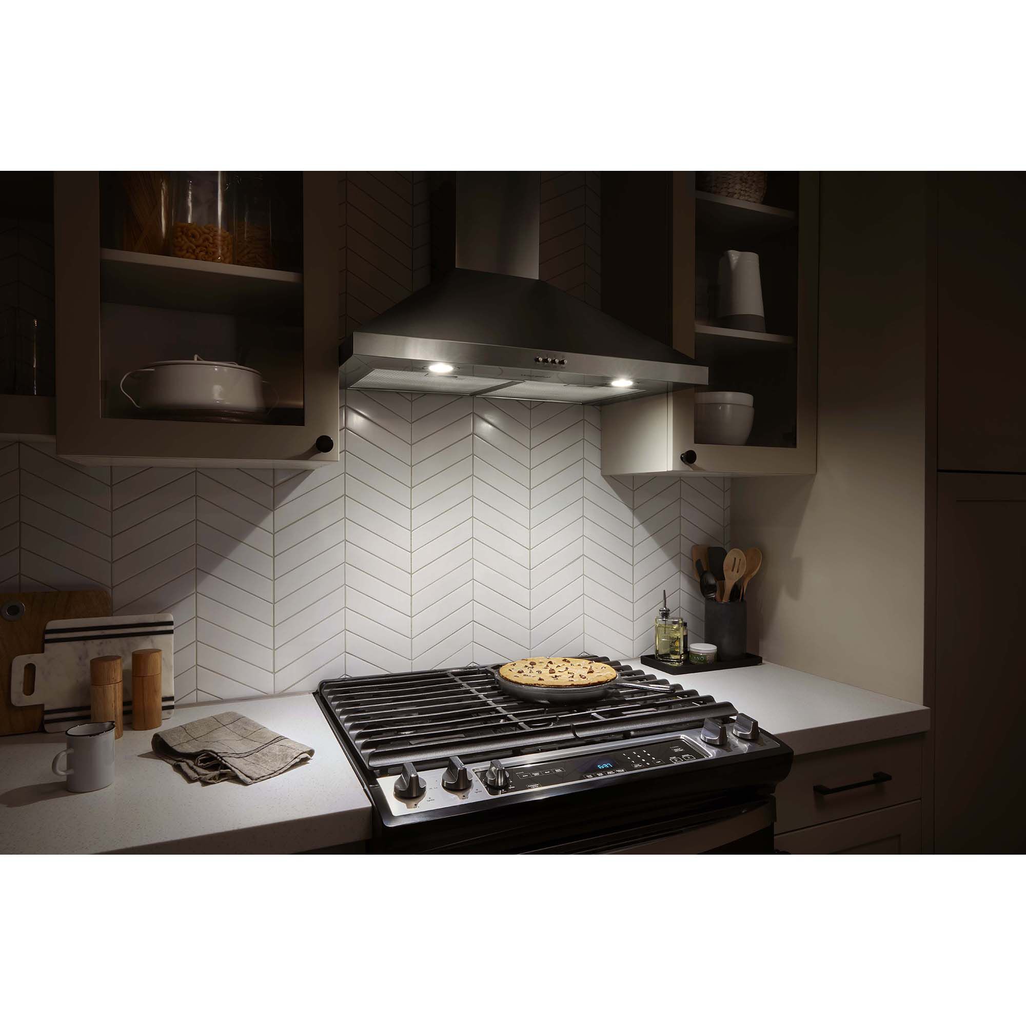 Underside of Whirlpool WVW53UC0LS range hood showing two LED lights illuminating the cooktop surface below.