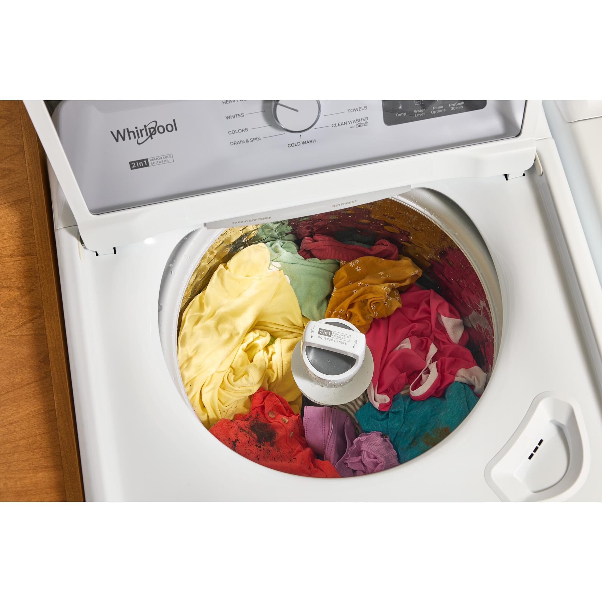 Interior view of the Whirlpool WTW4107SW top load washer tub showing large capacity and removable agitator.