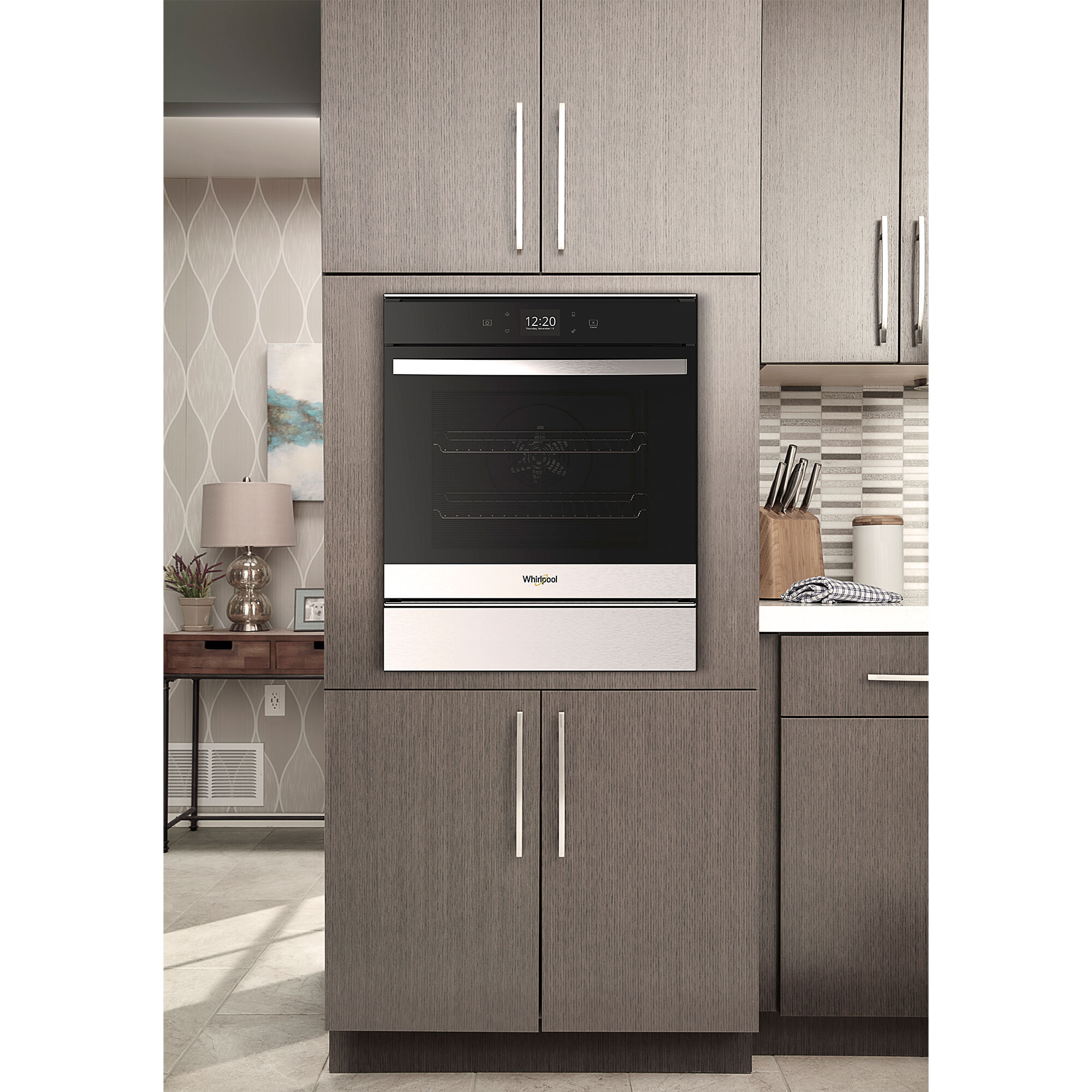 Whirlpool WOS52ES4MZ 24-inch wall oven installed in a kitchen cabinetry setting.