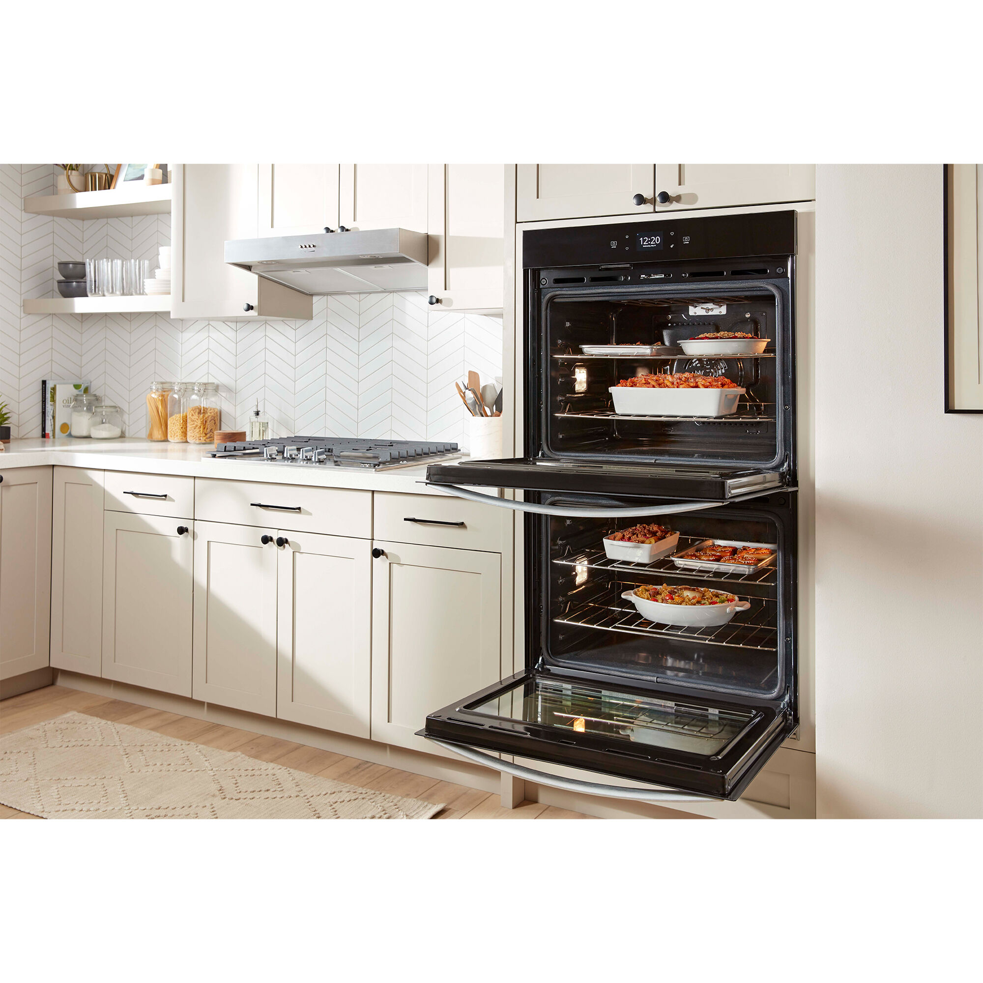Interior view of the Whirlpool WOED5027LZ double wall oven showing two large oven cavities with racks extended.