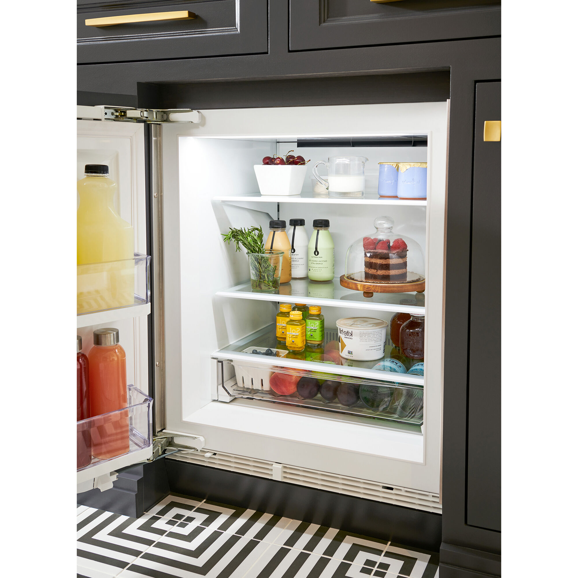 Interior view of Sub-Zero DEU2450R/L showing shelving, door storage, and panel-ready design detail