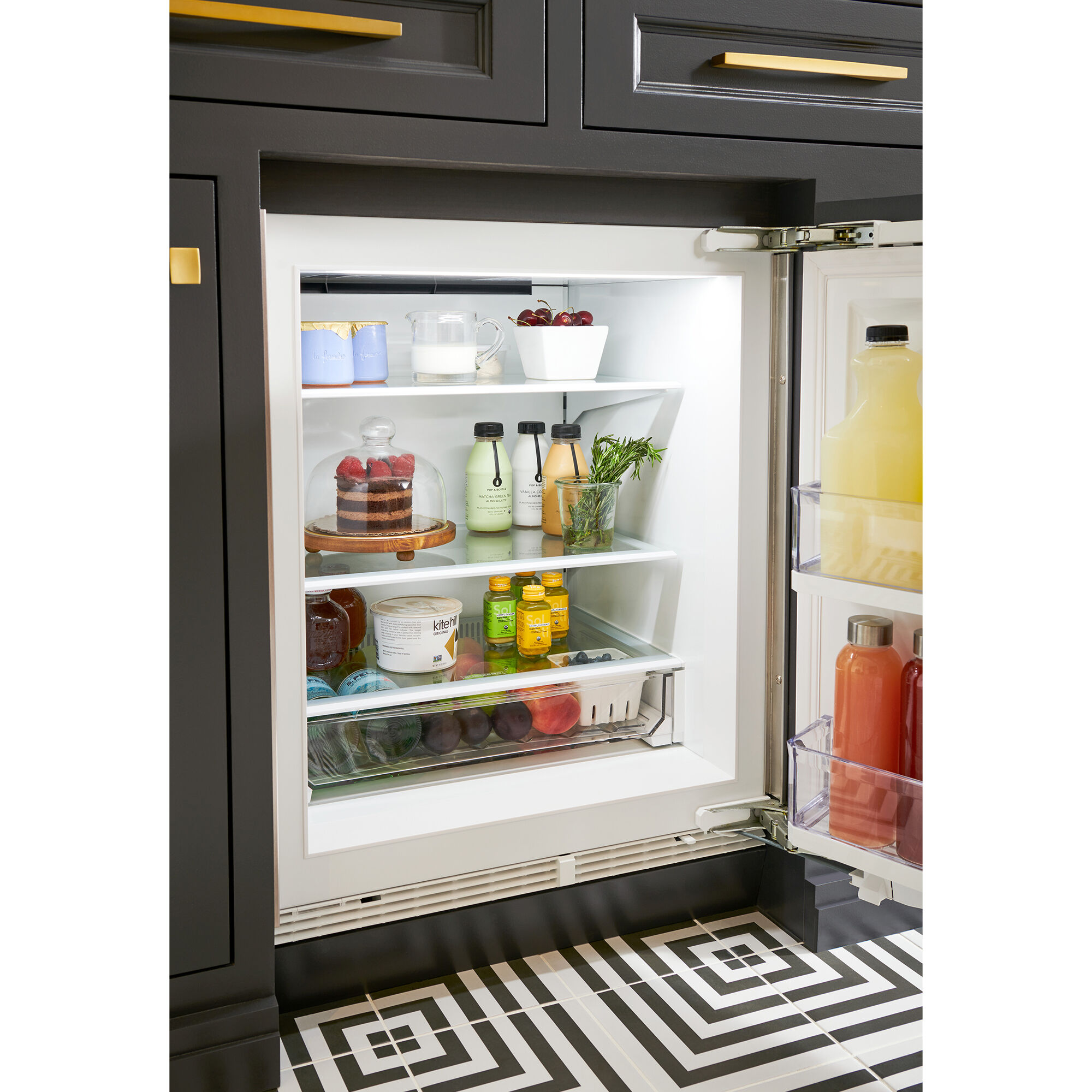 Interior view of Sub-Zero DEU2450R/R showing shelving, door storage, and panel-ready design detail