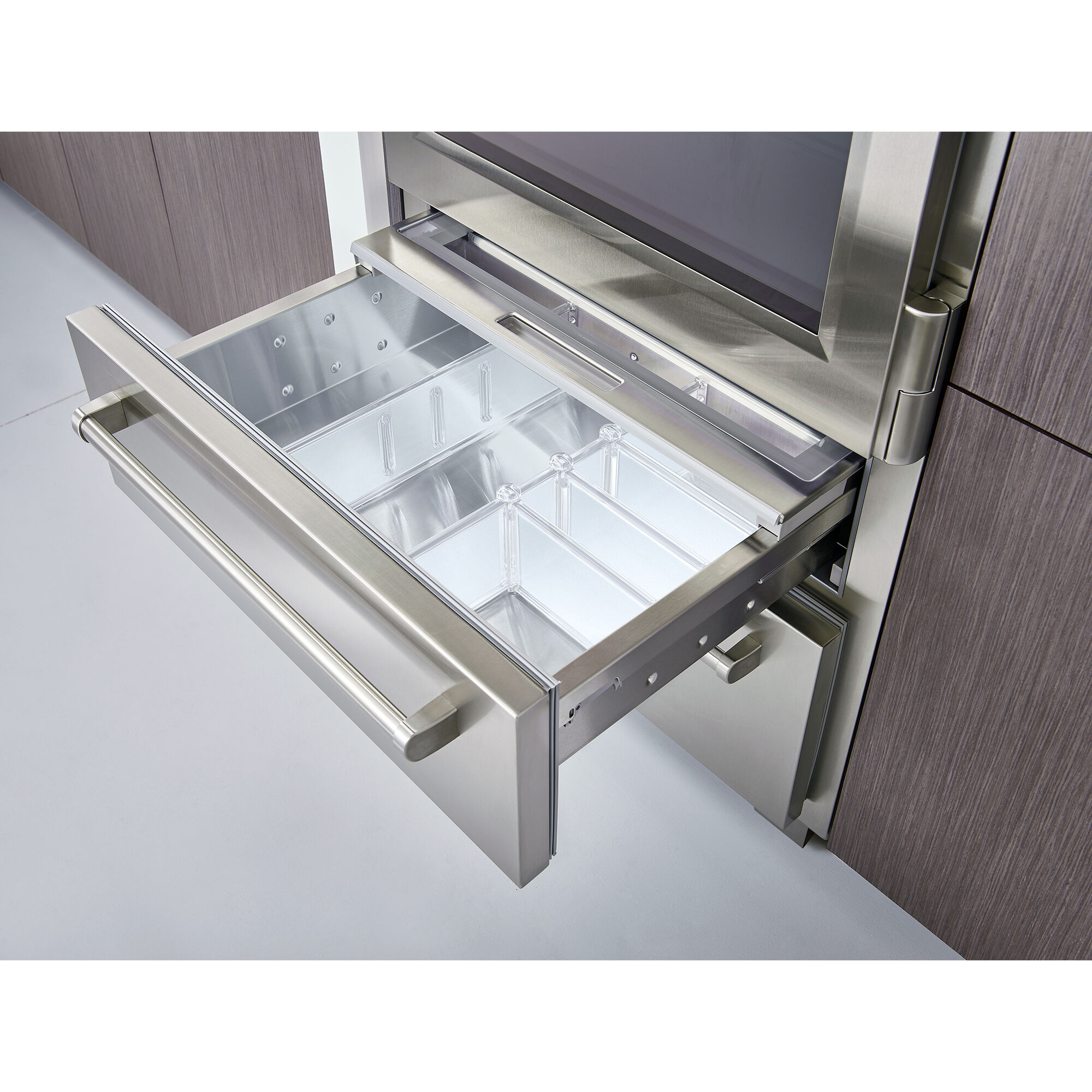 Interior view of Sub-Zero PRO3650LH showing stainless steel shelving, bottom freezer drawer, and premium interior finish