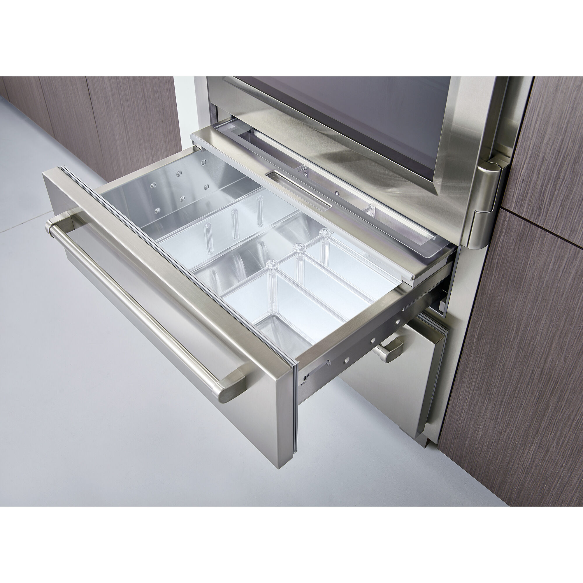 Interior view of Sub-Zero PRO3650RH showing stainless steel shelving, bottom freezer drawer, and premium interior finish