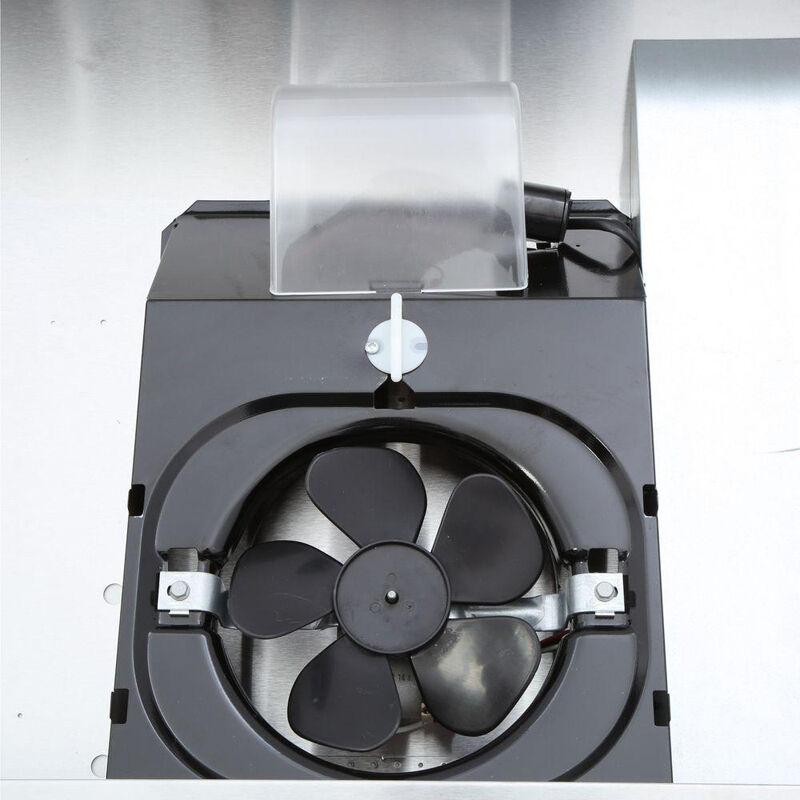 Close-up of range hood ventilation fan drawing steam and smoke away from a stovetop during cooking.