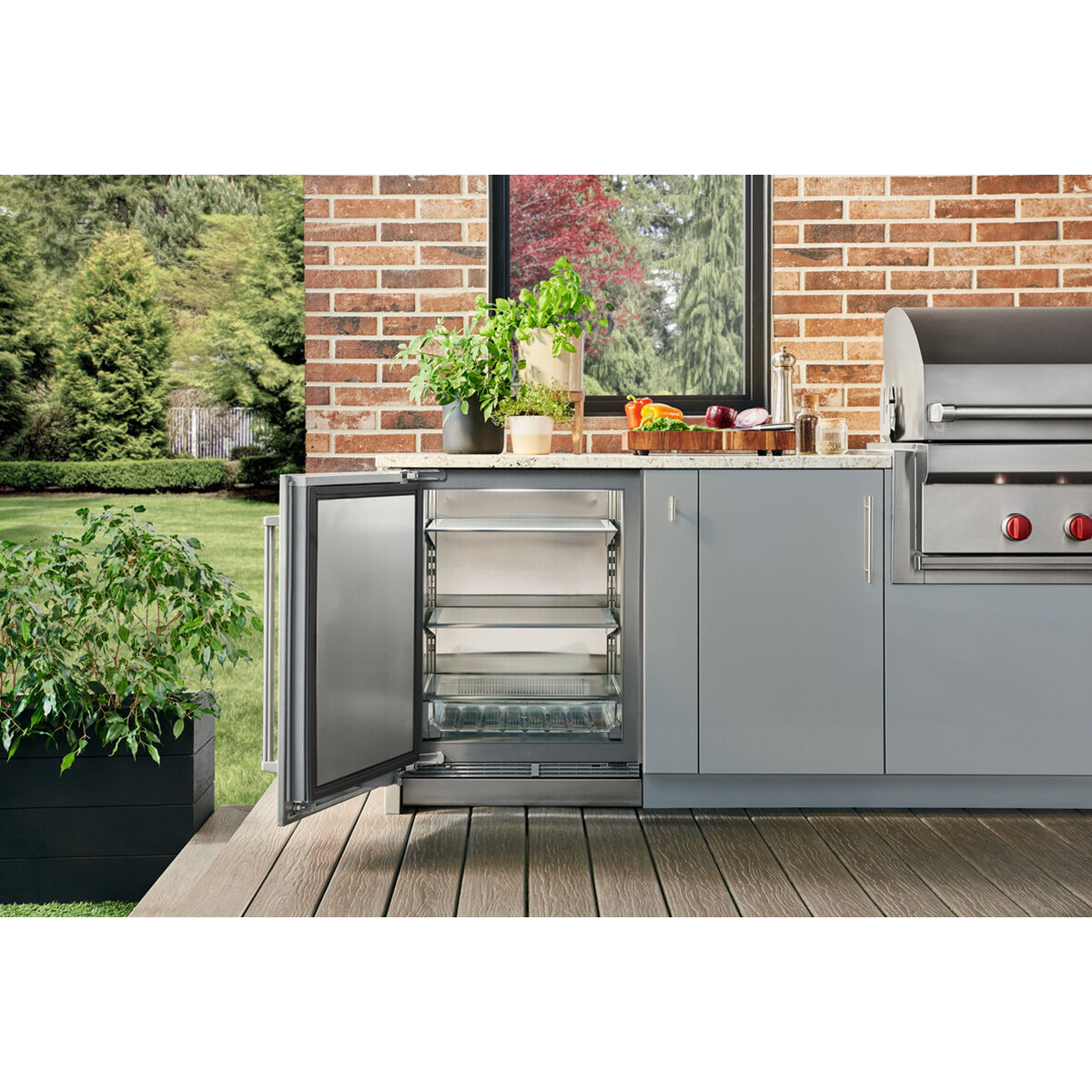 Interior view of Sub-Zero DEU2450RO/L showing stainless steel interior and adjustable shelving