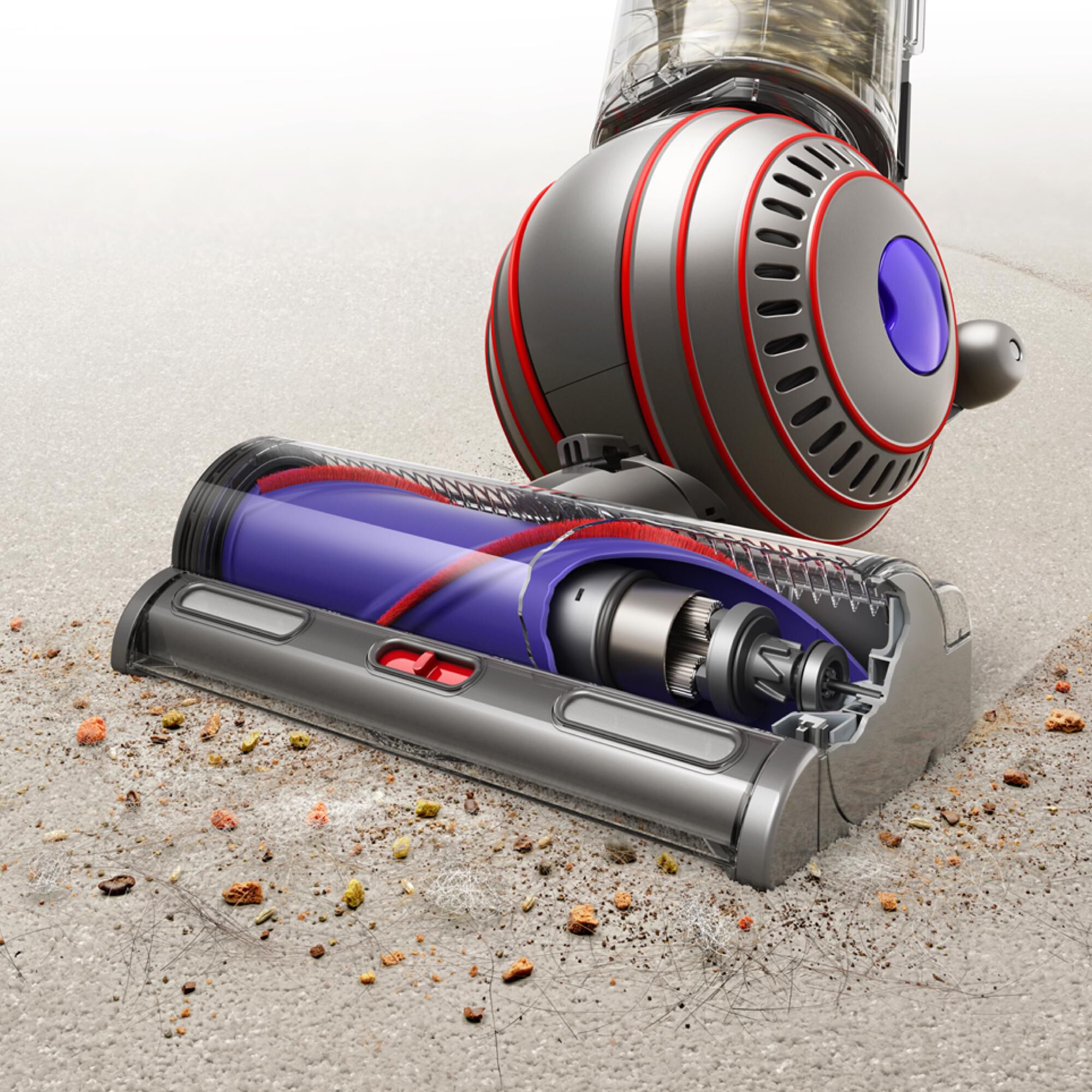 Close-up of the Dyson Ball Animal 3 Motorbar cleaner head cleaning deep into a carpet, demonstrating suction power and brush roll action.