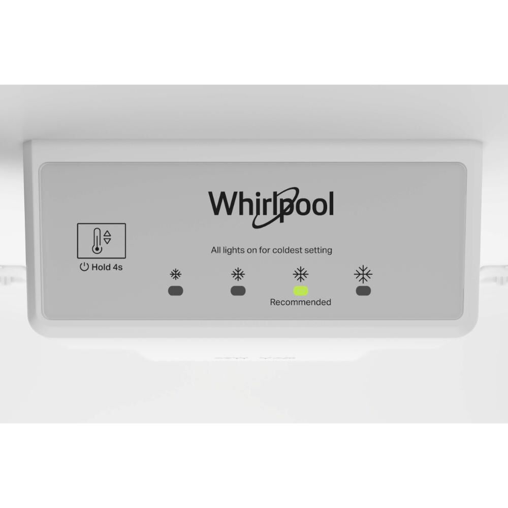 Interior view of the Whirlpool WRTX3314TZ top freezer refrigerator showing upfront electronic temperature controls.
