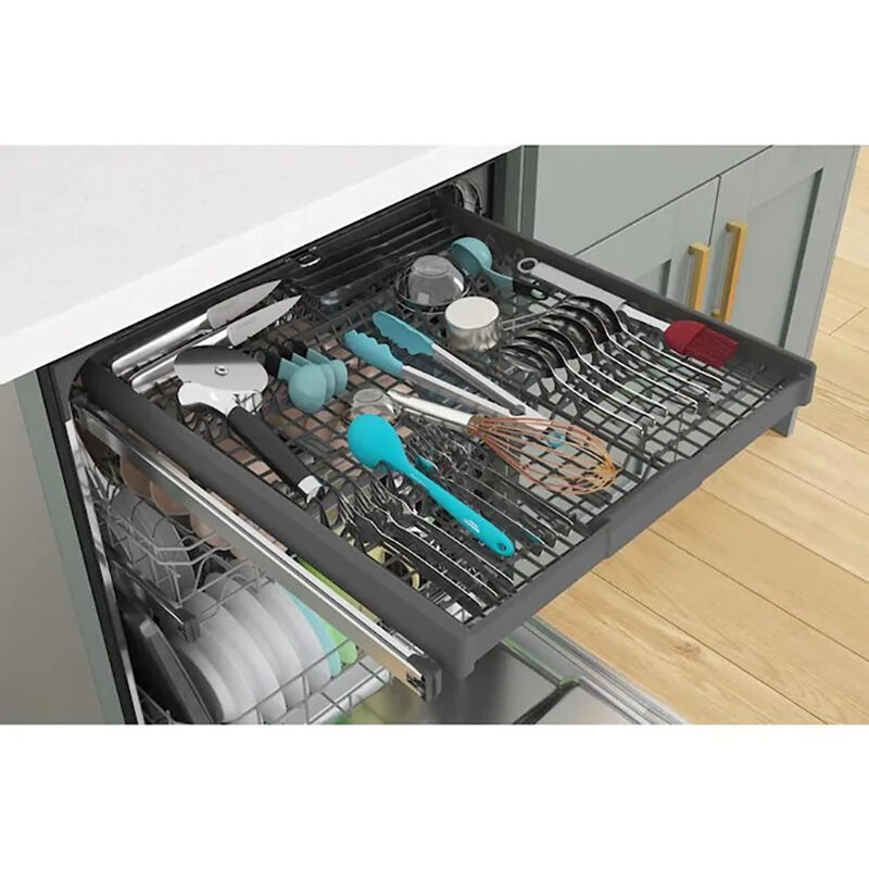 Whirlpool WDT750SAKW white dishwasher interior showing third rack loaded with utensils and lower baskets loaded with dishes.
