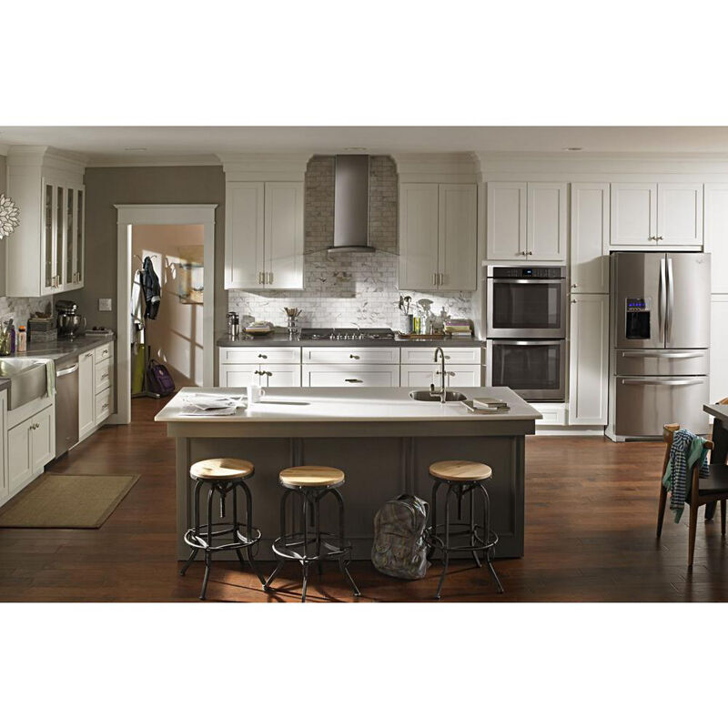 Whirlpool WVI75UC6DS 36-inch modern glass island mount range hood in stainless steel installed above a kitchen island cooktop.