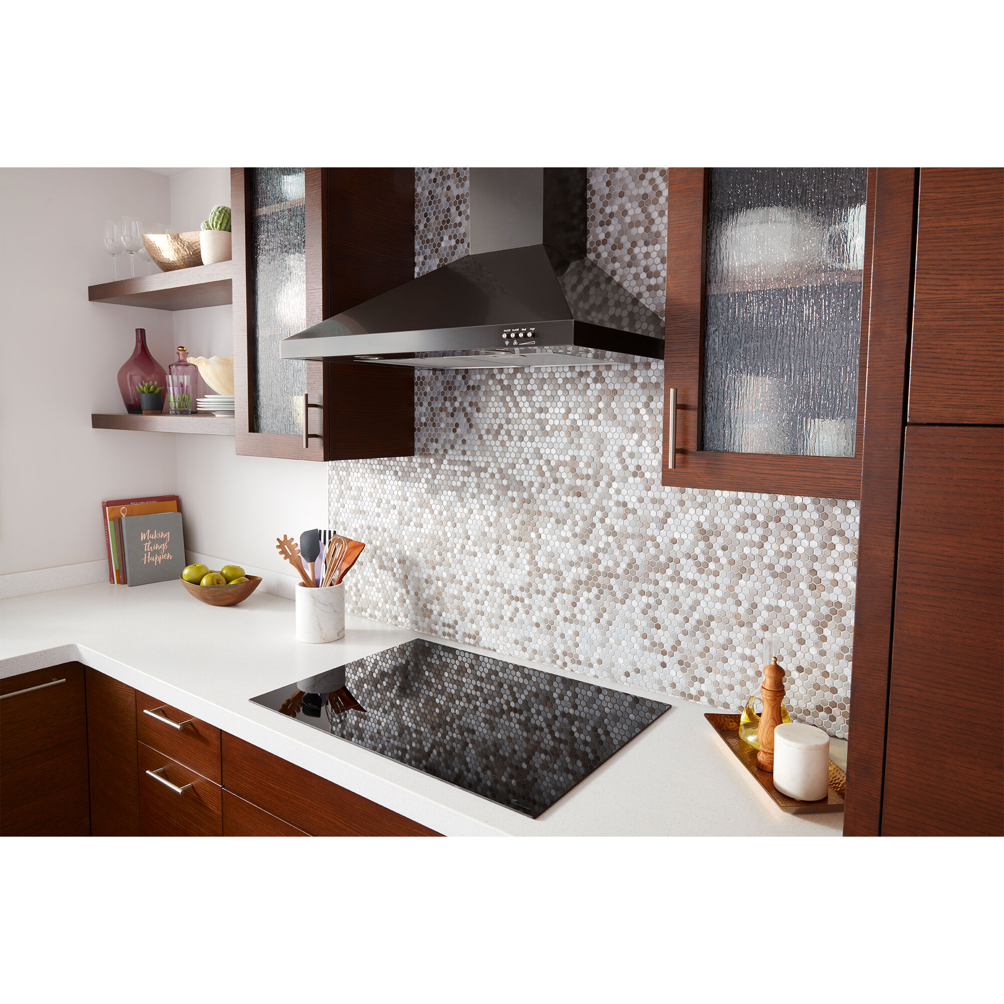 Whirlpool WVW53UC0HV range hood chimney tower mounted on kitchen wall above a gas cooktop in a modern kitchen setting.