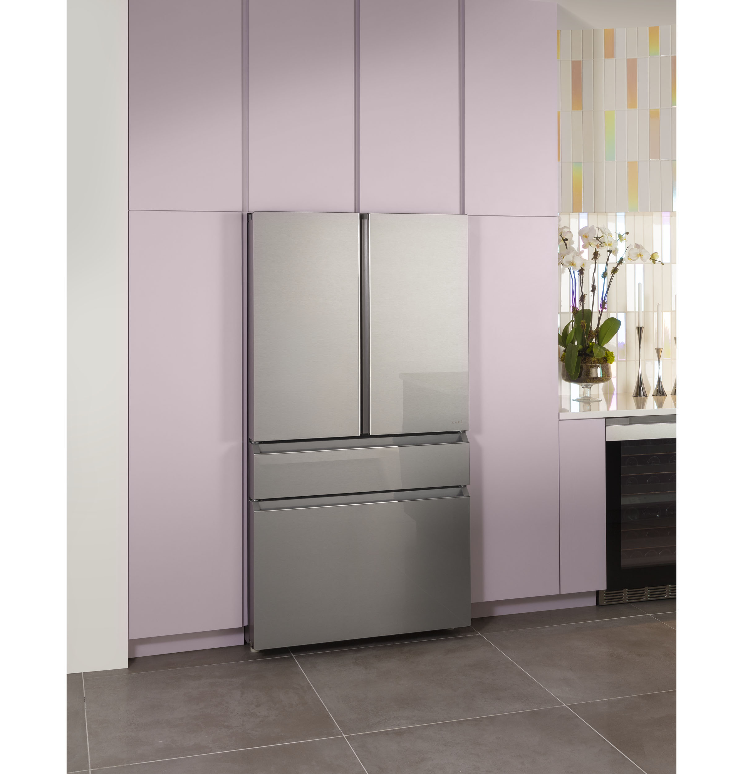 Cafe Refrigerator model CXE22DP2PS1, lifestyle view of fridge built-in, counter-depth, and flush with surroundings cabinetry