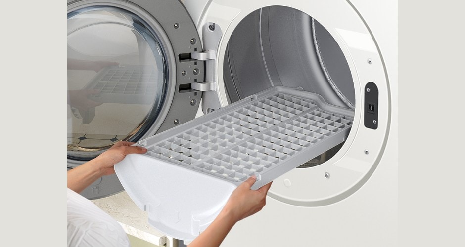 Samsung DV90F Series Ivory Gas dryer with a removable drying rack being inserted for delicate items or flat drying.