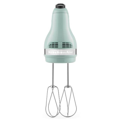 KitchenAid KHM512IC hand mixer in ice blue with two chrome beaters attached, shown standing upright on a white background.