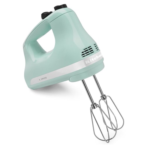 KitchenAid KHM512IC 5-speed hand mixer in icde blue, shown angled on its side with two chrome beaters attached against a white background.