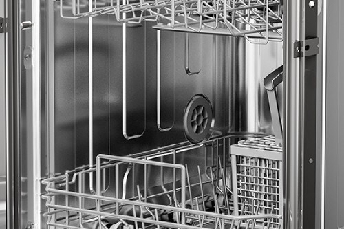 Midea 18-inch dishwasher interior with empty racks, silverware basket, and stainless steel walls visible.