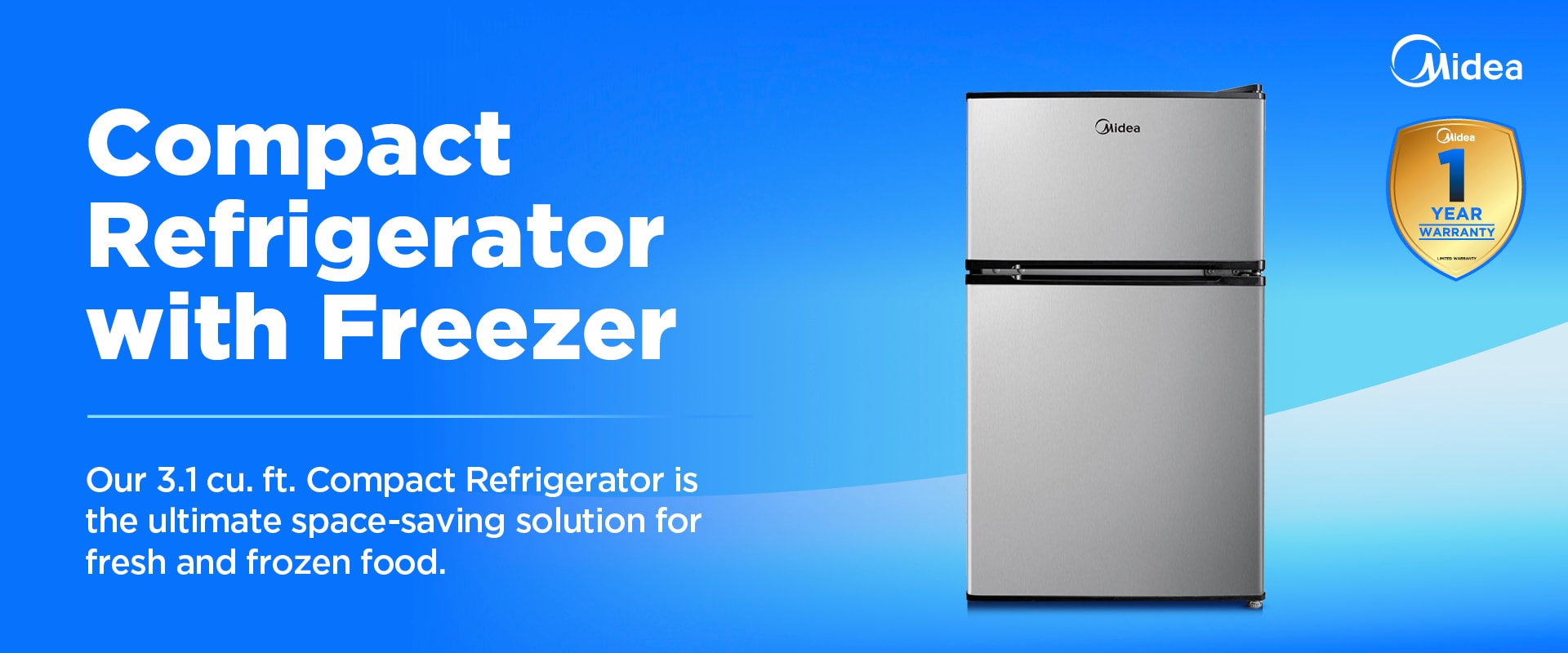 Midea 3.1 cu. ft. compact refrigerator with top freezer in stainless steel finish, featuring 1-year warranty badge and space-saving design.