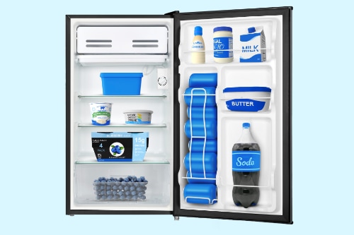 Compact refrigerator interior with door open, showing three wire shelves stocked with food containers and a small freezer compartment. Door shelves hold milk, butter, and beverages.