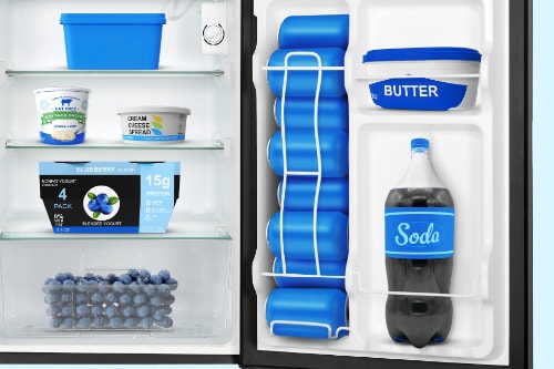 Interior view of compact refrigerator showing three wire shelves with food storage containers and door shelves holding milk, butter, and a soda bottle.