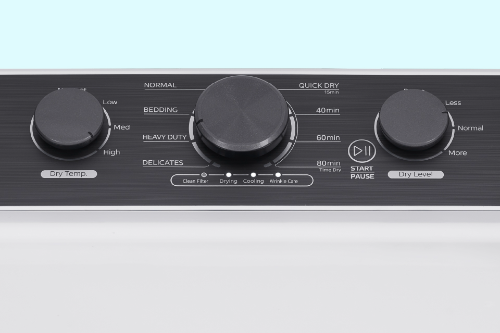 Close-up of dryer control panel with black rotary dials for temperature (No Heat to High), cycle selection (Normal, Bedding, Heavy Duty, Delicates, Quick Dry), and dryness level (Damp to More).