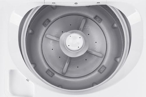 Top-down view inside washer tub showing pulsator wash system with radial fins and perforated design for efficient water circulation in 3.9 cu. ft. capacity.