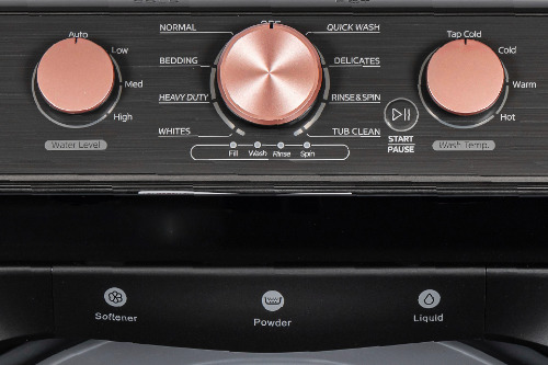 Close-up of washer control panel with rose gold dials for Water Level, cycle selection (Normal, Quick Wash, Bedding, Delicates, Heavy Duty, Rinse & Spin, Whites, Tub Clean), and Wash Temp.