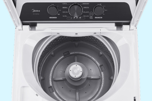 Top-down view of open Midea top load washer showing stainless steel wash basket with center agitator and black control panel with three dial knobs