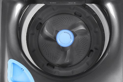 Top-down view of open Midea smart washer showing dark wash tub with center agitator, blue accent ring, and perforated basket design