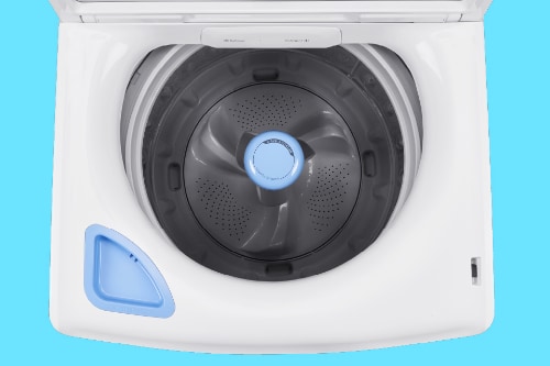 Overhead view of Midea top load washer interior showing stainless steel tub with center agitator and white exterior basin with built-in dispenser compartment