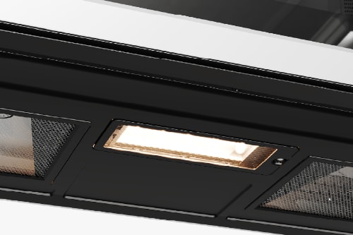 Underside view of the Midea MMO19S3AST microwave showing the built-in cooktop light illuminated between mesh filters.