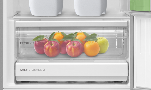 Clear refrigerator crisper drawer labeled 
