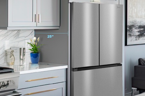 Midea MRF23I5AST stainless steel French door refrigerator installed in a modern kitchen, highlighting its 25-inch counter-depth profile that fits flush with surrounding cabinetry.