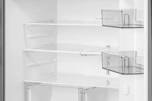 Empty interior of Midea Refrigerator Model MRF23I5AST showing adjustable glass shelves, clear door bins, and bottom crisper drawers for flexible food storage.