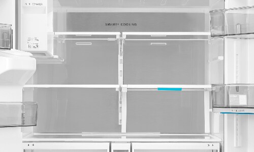 Top-down view of Midea French door refrigerator interior showing Smart Cooling system layout with multiple glass shelves, door bins, and dual crisper drawers for optimal organization.