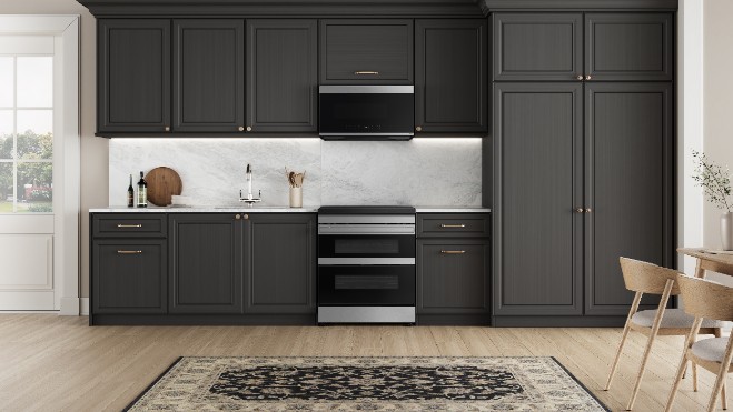 Smartphone displaying Samsung SmartThings app interface for remote oven control, with stainless steel double oven range in background and connectivity icon above