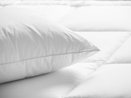 White pillow on a bed 