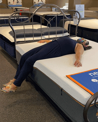 Animated Gif of Woman Lying on Mattress in a Store