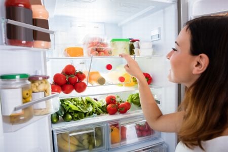 Woman Browsing Food in Refrigerator
