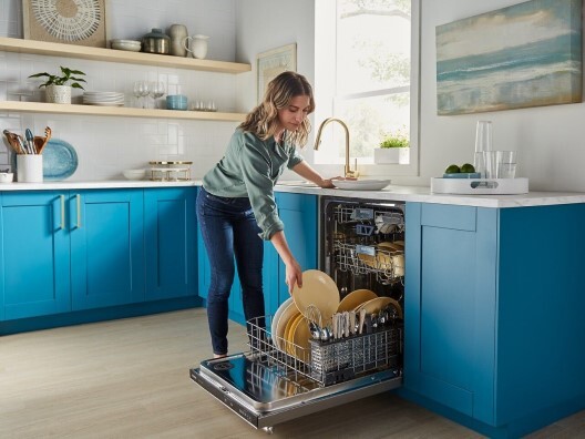 Woman Unloading Maytag Dishwasher