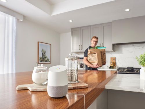 Man in Kitchen with Google Assistant in Foreground