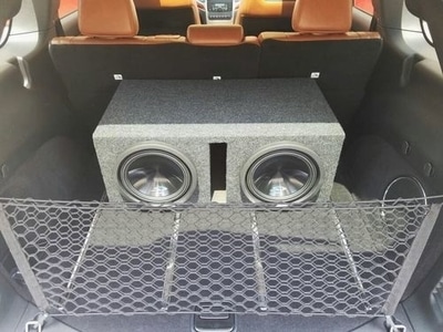 Subwoofer box installed in Jeep Cherokee hatch area