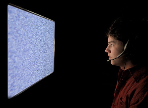 Young Man Too Close to TV Screen