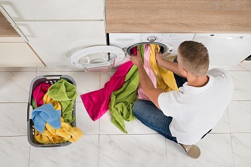 Man unloading dryer