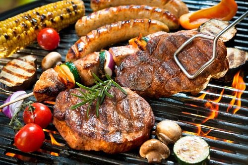 Assorted meat and vegetables on a grill
