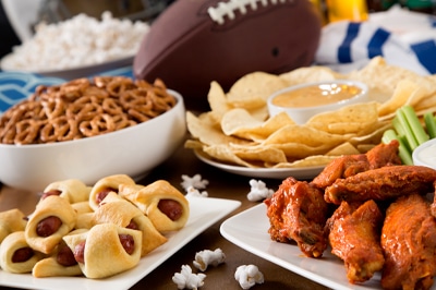 Party Snacks with Football in Background