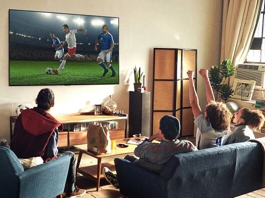 Group of People Watching Soccer on an LG G1 Series TV