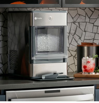 Ice Maker Sitting on Countertop with Ice Scoop Resting in Front