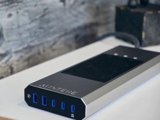 Austere surge protector resting on desk